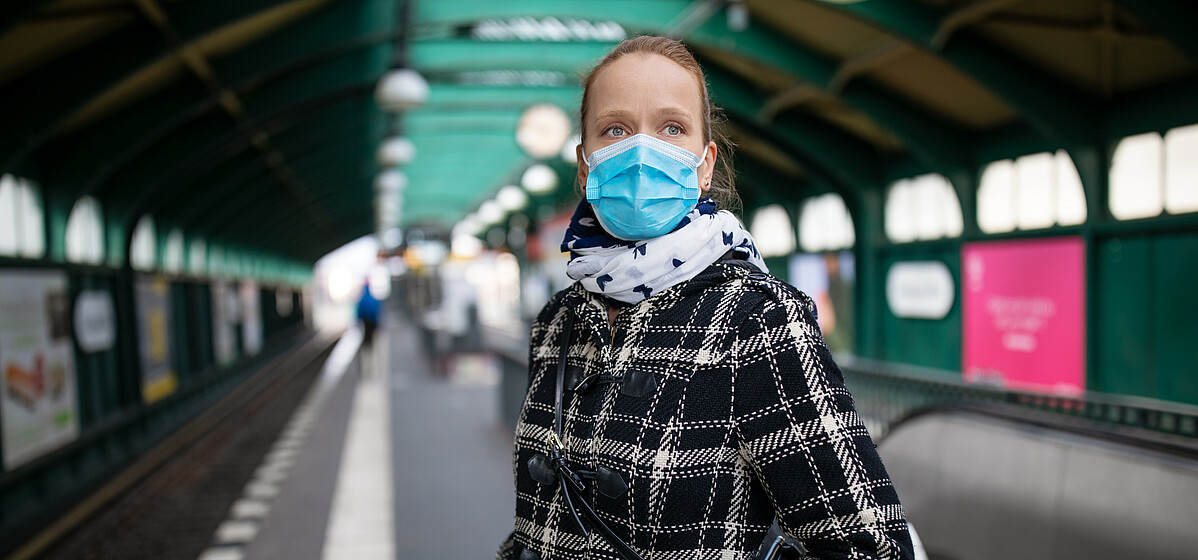 Less people are using public transport since the outbreak of Covid 19 - © iStock by Getty Images Woman wearing mask waiting for the city train at an almost empty Berlin station