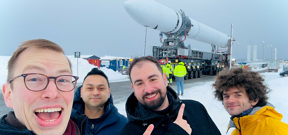 The CyBEEsat team in front of the Isar Aerospace rocket in Andoya.